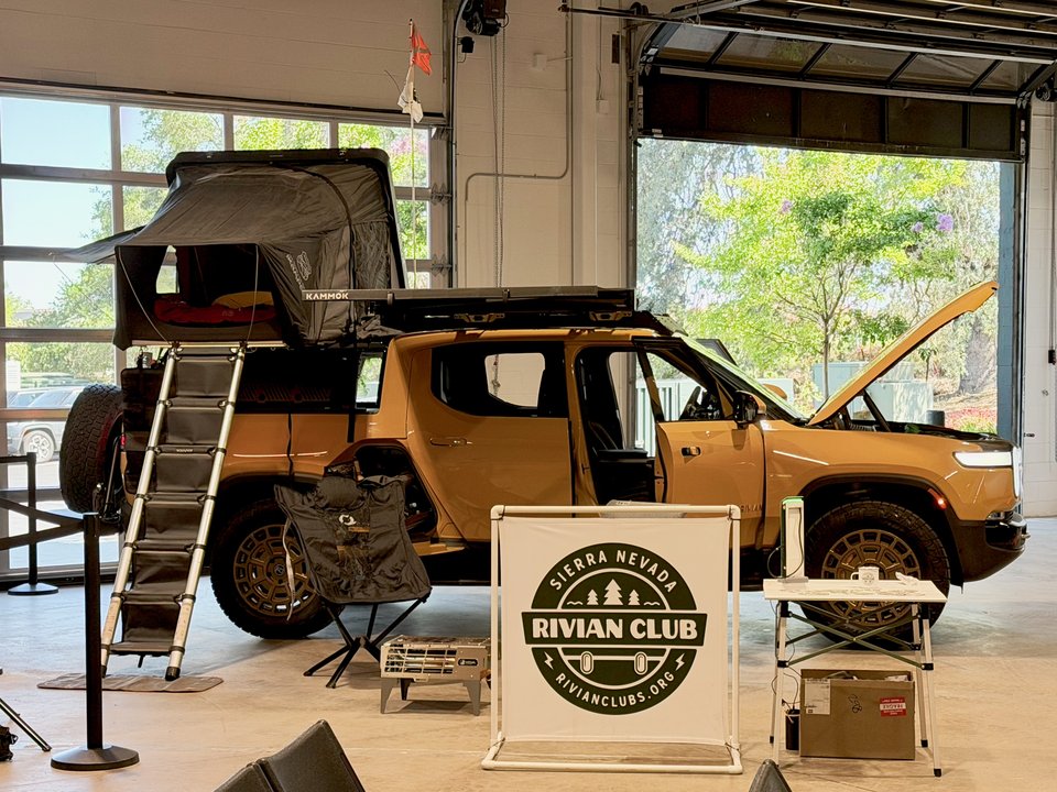 Rivian club event display with a rooftop tent