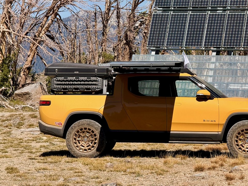 Crosswing awning mounted above the Rivian cab at sunset