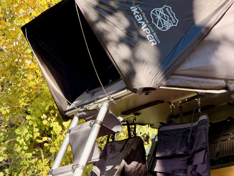 Rivian R1T with its iKamper rooftop tent open