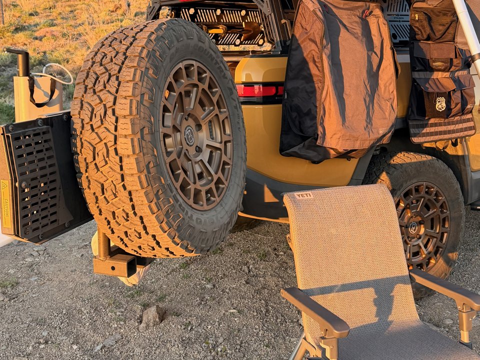 RIGd UltraSwing spare tire carrier and table behind the truck